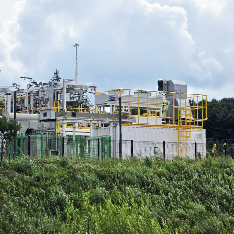 Containerized hydrogen electrolyzer and rectifier system at Jeju Island renewable energy site in Korea.